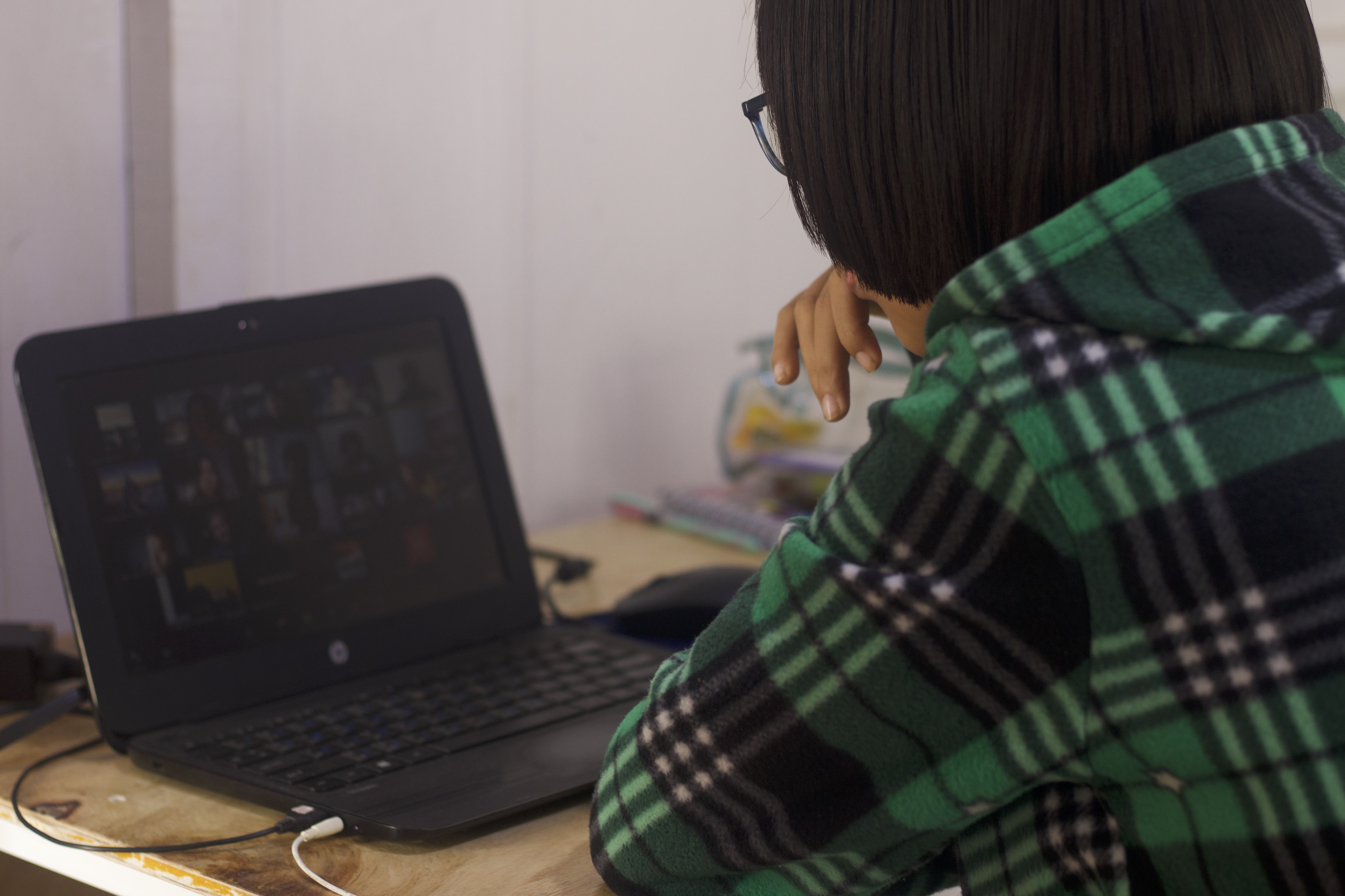 Student sitting in front of a laptop